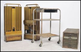 A collection of vintage industrial items to include a metal filing cabinet, two tier trolley apair