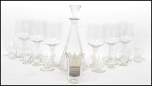 An early 20th century Art Deco French faceted glass decanter of tapering form with an inverse