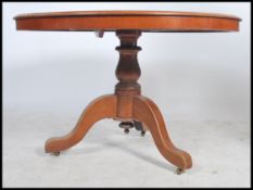 A large Victorian mahogany loo / tilt top dining t