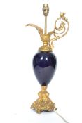 A vintage 20th century ewer jug table lamp having a cobalt ceramic body with rococo influence gilt