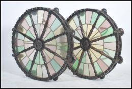 A pair of large 20th century coloured and leaded glass ceiling light fixtures in the form of ships