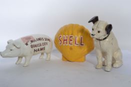 A group of three vintage 20th century cast iron novelty advertising money boxes, to include Quaker