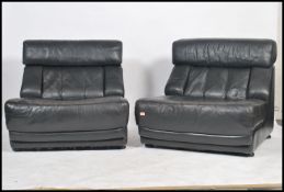 A retro 20th century modular Nucleus black leather sofa by Tetrad Associates each unit with