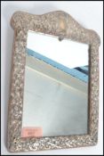 A stunning silver hallmarked late Victorian framed mirror with all-over C scroll and foliate