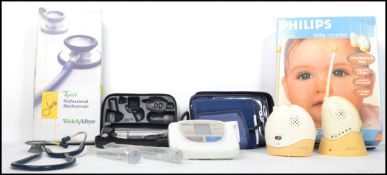 A small collection of medical items to include reflex tongs, Stethoscope, digital blood pressure