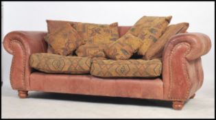 A pair of 20th century large two seat leather Ches