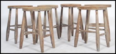 A good set of 6 Victorian 19th century oak refectory country stools. Each with turned legs united by