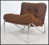 A retro 20th century 1970's lounge / sling chair in the manner of Pieff. A tubular construction