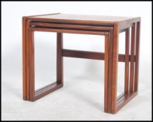 A good set of believed Danish retro teak wood 1970's graduating nest of tables. The tables having