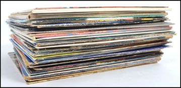 A collection of vinyl long play LP records to include The Beatles, The Police, Dr Hook, Hot