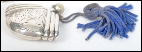 Two early 20th century silver ladies perfume bottles phials to include one of moon flask form with