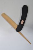 A vintage mid 20th century advertising point of sale cut throat razor, ebonised guard with natural