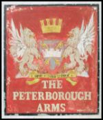 An original mid century Simonds ' The Hop Leaf ' pub sign in metal being handpainted to verso for