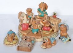 A collection of Pendelfin figures to include the band complete on the display stand together with