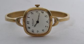 A sterling silver Tissot Le Logle ladies dress watch having a silver 925 rigid bracelet with