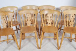 A set of eight 20th century Windsor style arm chairs having panel seats with turned columns and