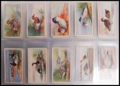Cigarette Cards: An album of assorted vintage cigarette cards, all complete sets. From a large
