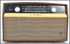 A vintage 0th century Bush VHF 1 valve radio - radiogram with dial and decorative facia in shaped