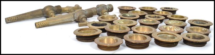 A collection of vintage 20th century breweriana brass ale keg taps and a collection of brass