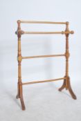 A Victorian style beech wood towel rail with out s