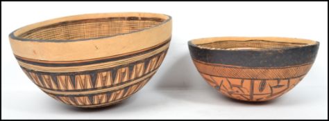 Two vintage 20th century wooden African gourds fro