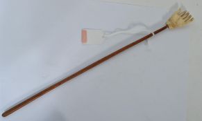 A 19th century bone carved back scratcher in the f