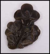 An Oriental carved jade carving depicting blossomi
