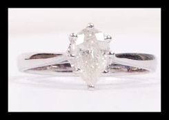 An 18ct white gold pear shaped diamond ring of app