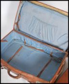 A group of vintage 20th century leather luggage to