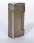 A vintage 20th century Dunhill lighter having an e