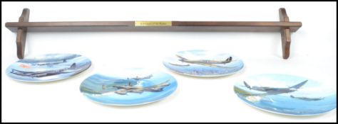 A group of four Royal Doulton collectors plates ti