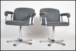 A pair of retro 20th century salon swivel armchair
