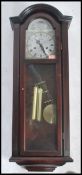 A vintage 20th century wooden cased wall clock hav