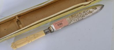 A 19th century ivory handled cake knife with silve