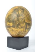 A Victorian style painted ostrich egg having a yel