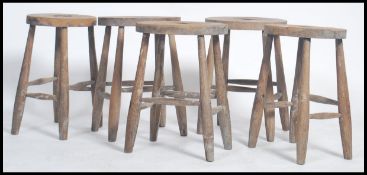A good set of 5 Victorian 19th century oak refectory country stools. Each with turned legs united by