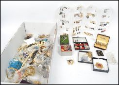 A large collection of costume jewellery to include bracelets, bangles, necklaces, rings, watches,