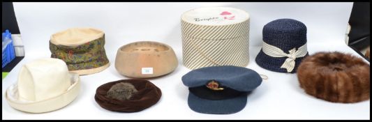 A collection of vintage 20th century ladies hats together with a Flight Lieutenants cap ( dated 1945