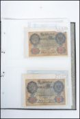 A collection of vintage banknotes include early German Reichsbanknote 10 shillings 20 Marks, Bank Of