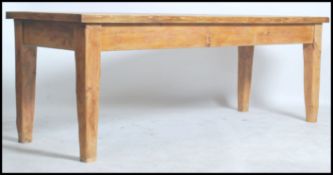 A fantastic large rustic country pine refectory table with a twin plank top in rectangular form
