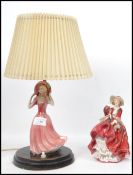 A Royal Doulton ceramic figurine Top O The Hill HN1834 red colourway along with a ceramic figurine