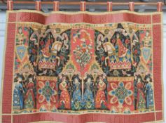 A wall hanging tapestry banner depicting depicting Medieval subjects and scenes hung from a wooden