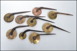 A good collection of 9 finishing rolls ( leather tools ) to include examples by Timbury of London,