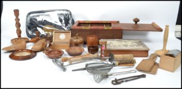A collection of vintage 20th century wooden treen wares, vintage kitchenalia, to include an ebony