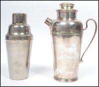 A vintage 20th century art deco Harrods of London white metal cocktail shaker along with another