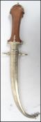 An early 20th century curved Islamic Jambiya dagger, the sheaf decorated with medallions and