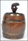 An unusual mid century Dorset Light Industries barrel and bear table lighter.  Oak barrel with
