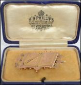 A 9ct gold Mizpah brooch inscribed ' The lord watch between thee and me, we are absent one from