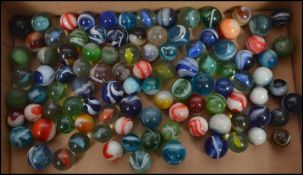 A good collection of 19th century and 20th century glass marbles , please see images.