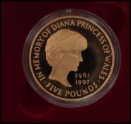 A Royal Mint Princess Diana £5 gold proof memorial coin, 1961-1997 within a capsule, complete in